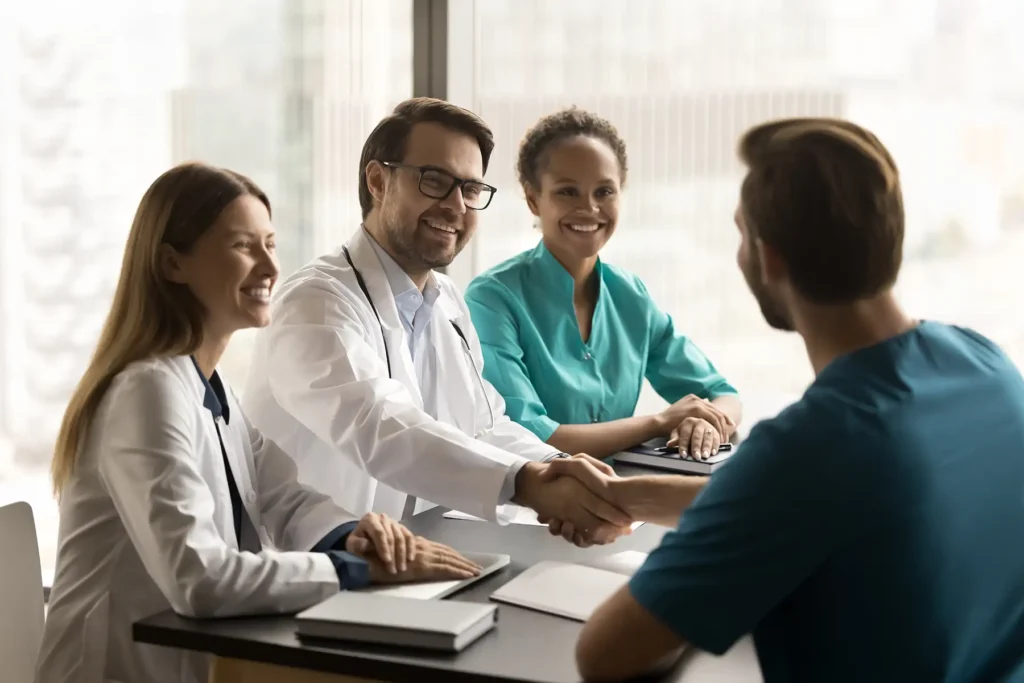 Clinic head doctor shaking hands